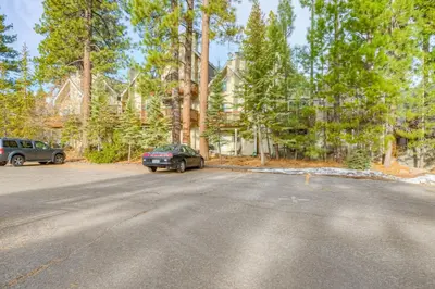 a car parked on the side of a road with trees at Crystal Bay Comfort in Incline Village