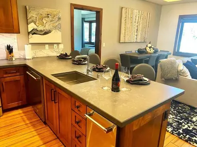 a kitchen with a counter with wine glasses on it at Ski In/Out - Zalanta - Great Location- 2 Hot Tubs - Heated Pool in South Lake Tahoe