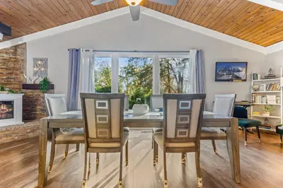 a dining room with a table and chairs and a fireplace at Fully-Stocked, Pet-friendly, Relaxing Home Near Yosemite and Bass Lake in North Fork