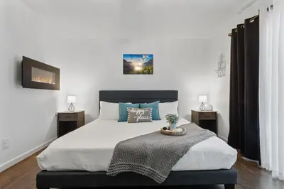 a bedroom with a large bed with two night stands at Fully-Stocked, Pet-friendly, Relaxing Home Near Yosemite and Bass Lake in North Fork