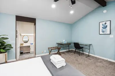 a room with blue walls and a table and a chair at Mountain View, Hot Tub, Open Kitchen, 10m to Sequoia in Three Rivers