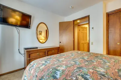 a bedroom with a bed and a flat screen tv at Mammoth Lakes Condo about 5 Mi to Mammoth Mtn! in Mammoth Lakes