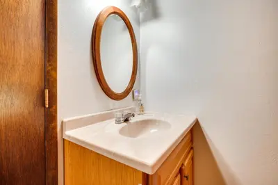a bathroom with a sink and a mirror on the wall at Mammoth Lakes Condo about 5 Mi to Mammoth Mtn! in Mammoth Lakes