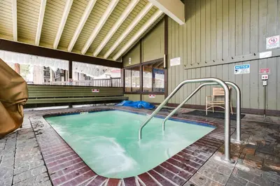 a large pool of green water in a building at Mammoth Lakes Condo about 5 Mi to Mammoth Mtn! in Mammoth Lakes