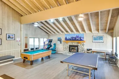 a room with a pool table and a fireplace at Mammoth Lakes Condo about 5 Mi to Mammoth Mtn! in Mammoth Lakes