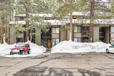 a red jeep parked in front of a house at Mammoth Lakes Condo about 5 Mi to Mammoth Mtn! in Mammoth Lakes