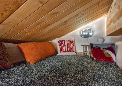 a bed in a room with a wooden ceiling at Northstar Village Condo Walk to Lifts 2 Full BA Excellent Location Hot-Tubs in Truckee