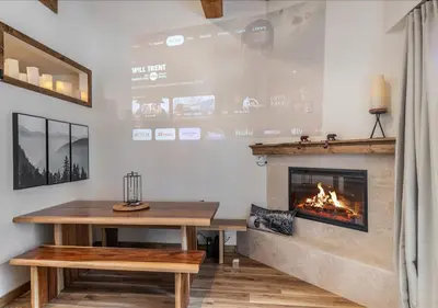 a room with a table and a fireplace at Northstar Village Condo Walk to Lifts 2 Full BA Excellent Location Hot-Tubs in Truckee