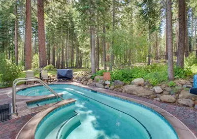 a swimming pool in the middle of a forest at Northstar Village Condo Walk to Lifts 2 Full BA Excellent Location Hot-Tubs in Truckee