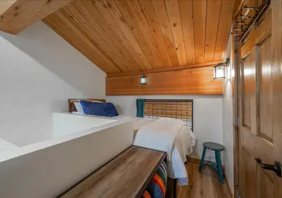 a bedroom with a bed and a wooden ceiling at Northstar Village Condo Walk to Lifts 2 Full BA Excellent Location Hot-Tubs in Truckee