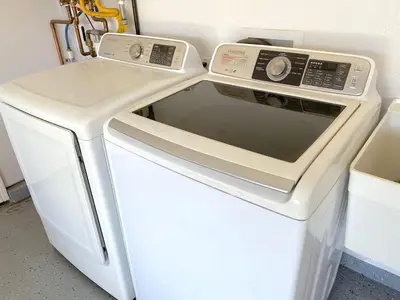a white stove top oven next to a white refrigerator at Mountain Escape, Yosemite South Gate House with Hot Tub, Views & Game Room, Near town in Oakhurst