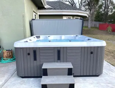 a hot tub in the backyard of a house at Mountain Escape, Yosemite South Gate House with Hot Tub, Views & Game Room, Near town in Oakhurst