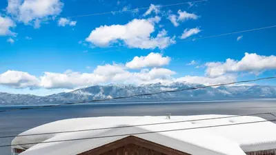 a view of the mountains from the wing of an airplane at Chickadee by AvantStay Modern A-Frame Cabin in Tahoe City