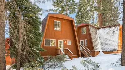 a cabin in the woods in the snow at Chickaree by AvantStay A-Frame w Mountain Views in Tahoe City