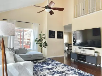 a living room with a couch and a ceiling fan at Reno Gem 3 and a half Miles to DT, 40 Miles to Tahoe in Reno