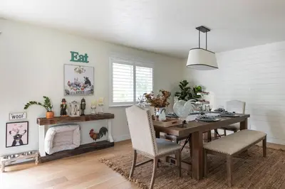 a dining room with a wooden table and chairs at Relax at Yosemite, Cozy House with King Bed, Private Hot Tub & Fast Wi-Fi, Near town in Oakhurst