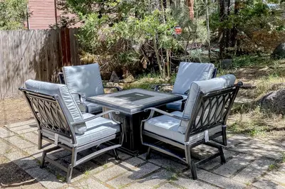 three chairs and a table and a table and chairs at The Chalet at Kings Beach Unit 2 in Kings Beach
