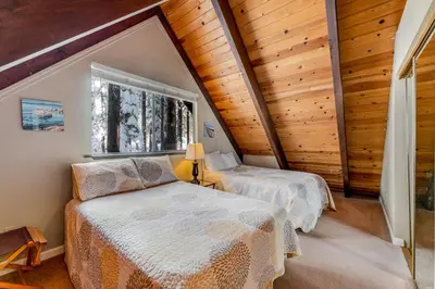 a bedroom with two beds and a window at Fairway Forest in Incline Village