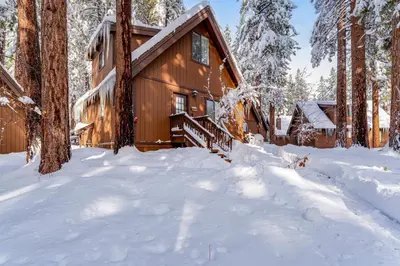 a cabin in the woods in the snow at Fairway Forest in Incline Village