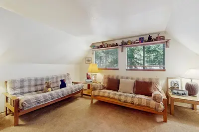 a living room with two couches and a window at Talmont Trailhead Cabin in Tahoe City