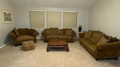 a living room with two couches and a coffee table at Beautiful peaceful desirable home in Madera Rancho in Madera