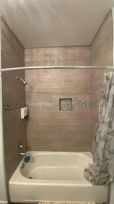 a white tub in a bathroom with a shower at Beautiful peaceful desirable home in Madera Rancho in Madera