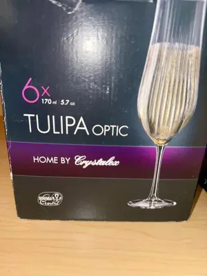 a wine glass sitting on top of a box at The Happy Cabin w/ hot tub in Oakhurst