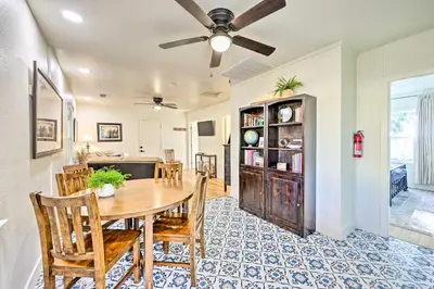 a dining room and living room with a table and chairs at Peaceful Ranch Home with Sierra Nevada Views in Woodlake