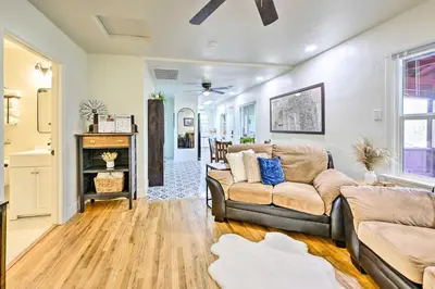 a living room with a couch and a fireplace at Peaceful Ranch Home with Sierra Nevada Views in Woodlake