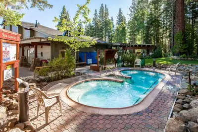 a swimming pool in the yard of a house at Rocky Revival in Truckee