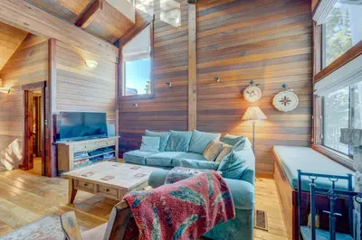 a living room with a couch and a tv at Rocky Revival in Truckee