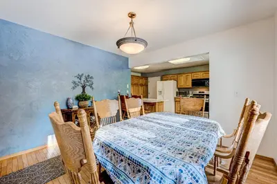 a dining room with a table and a kitchen at Lakeview Serenity in Incline Village
