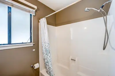 a bathroom with a shower and a window at Lakeview Serenity in Incline Village