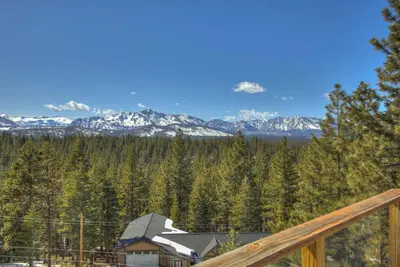 a view of the mountains from the deck of a cabin at Enviable Lake & Mountain Views Wth Waterfall in South Lake Tahoe