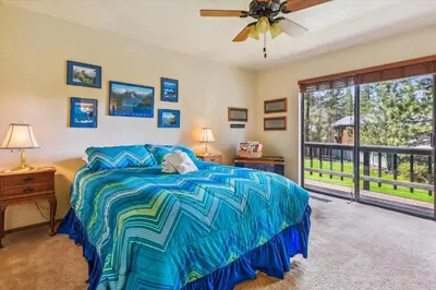 a bedroom with a bed and a ceiling fan at Minutes From Heavenly Valley & Lake Tahoe Beaches in South Lake Tahoe