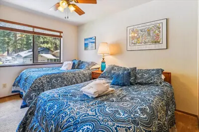 a bedroom with two beds and a window at Minutes From Heavenly Valley & Lake Tahoe Beaches in South Lake Tahoe