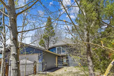 a house with a fence and trees at Private Beach, Close To Everything in South Lake Tahoe
