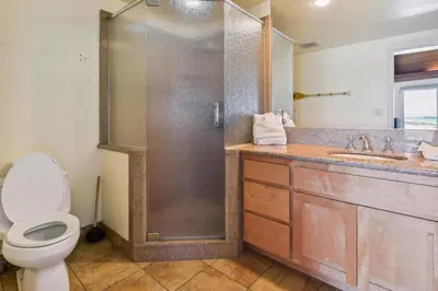 a bathroom with a shower and a toilet and a sink at Private Beach, Close To Everything in South Lake Tahoe