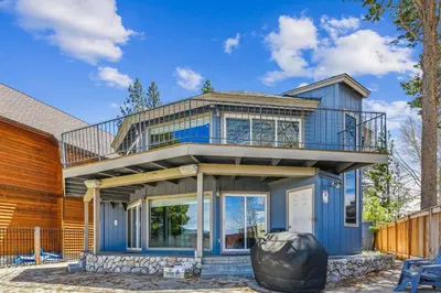 a blue house with a balcony at Private Beach, Close To Everything in South Lake Tahoe