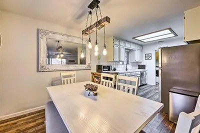 a kitchen and dining room with a wooden table and a dining room gmaxwell gmaxwell gmaxwell at North Fork Vacation Rental 28 Mi to Yosemite in North Fork