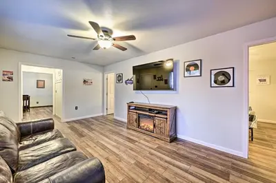 a living room with a couch and a fireplace at North Fork Vacation Rental 28 Mi to Yosemite in North Fork