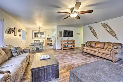 a living room with two couches and a ceiling fan at North Fork Vacation Rental 28 Mi to Yosemite in North Fork