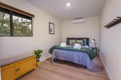 a bedroom with a bed and a window at Summit Cabin Stunning home Loaded with amenities in Oakhurst