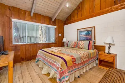 a bedroom with a bed with a stuffed animal on it at Eagles Nest at Bass Lake near Yosemite with Boat Dock in Bass Lake