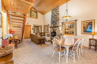 a living room with a table and chairs at Place to Call Home - Cabin INSIDE Yosemite - Dog Friendly in South Wawona