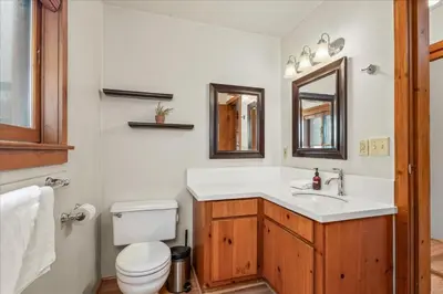 a bathroom with a sink and a toilet at Cub House- Remodeled cabin INSIDE Yosemite with new hot tub and more in North Wawona