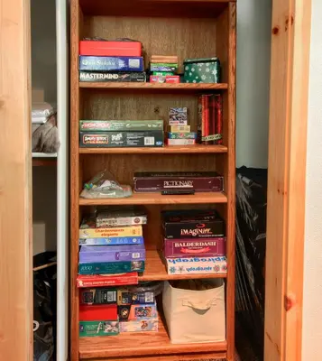 a book shelf filled with lots of books at Rivercrest Lodge with Hot Tub-Pool Table-Firepit in North Wawona