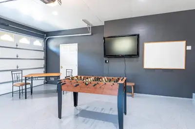 a game room with a foosball table and a tv at Skyline Lodge- amazing views w/spa/game room in Oakhurst