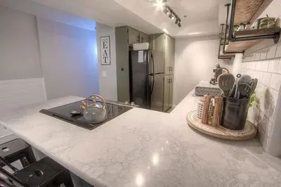 a kitchen with a counter top with a refrigerator at Taste of Burgundy condo in Incline Village