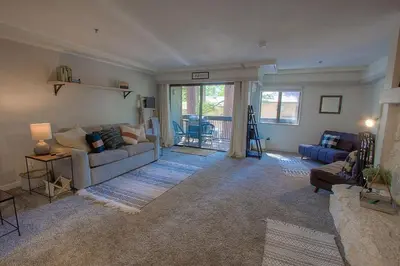 a living room with a couch and a table at Taste of Burgundy condo in Incline Village